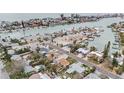 Aerial view showcasing waterfront property and neighborhood at 550 80Th Ave, St Pete Beach, FL 33706