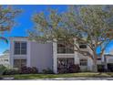 Two-story condo with mature trees and manicured lawn at 5697 Sheffield Greene Cir # 51, Sarasota, FL 34235