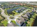 Aerial view of upscale homes and a lake at 6010 Anise Dr, Sarasota, FL 34238