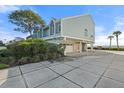 Exterior of two-story home with attached garage and waterfront views at 61 Tidy Island Blvd, Bradenton, FL 34210