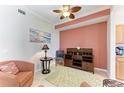 Bright den with wood cabinet and comfortable seating at 8105 Grand Estuary Trl # 307, Bradenton, FL 34212