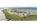 Aerial view of waterfront property showing building location and surrounding landscape at 1125 Edgewater Cir # 13 Sec 1, Bradenton, FL 34209