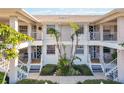 Condo building showcasing four units with landscaping and walkways at 1125 Edgewater Cir # 13 Sec 1, Bradenton, FL 34209