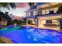 Expansive pool and spa with waterfall feature and outdoor entertaining area at 171 Mckinley Dr, Sarasota, FL 34236