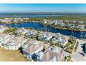 Wide aerial view of waterfront homes and community at 311 Compass Point Dr # 201, Bradenton, FL 34209