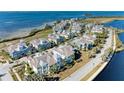 Aerial view of waterfront homes and community at 311 Compass Point Dr # 201, Bradenton, FL 34209