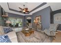 Spacious living room with hardwood floors and access to pool at 348 165Th Ne Ct, Bradenton, FL 34212