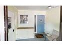 Bright and welcoming entryway with storage and seating at 3522 Silver Pine Ct # 90, Sarasota, FL 34231
