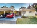 Updated condo featuring carport parking and tropical landscaping at 3522 Silver Pine Ct # 90, Sarasota, FL 34231