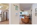 Open concept living area with stylish furniture and hardwood floors at 3522 Silver Pine Ct # 90, Sarasota, FL 34231
