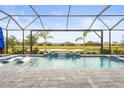 Resort-style pool with a covered lanai and tranquil water features at 4534 Trento Pl, Bradenton, FL 34211