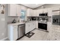 Modern kitchen with stainless steel appliances and granite countertops at 5371 Fleming St, Port Charlotte, FL 33981