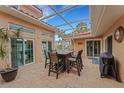 Covered patio with fire pit table and seating at 5376 Shadow Lawn Dr, Sarasota, FL 34242