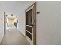Residential hallway with apartment entry doors at 618 Bird Bay S Dr # 201, Venice, FL 34285
