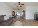Open living space showcasing hardwood floors and built-in shelving at 625 Ennis Nw Ter, Port Charlotte, FL 33952