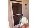 Condo entrance with screen door and number 202 at 6505 Stone River Rd # 202, Bradenton, FL 34203