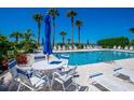 Inviting pool area with ample seating and beach views at 6925 Gulf Of Mexico Dr # 24, Longboat Key, FL 34228