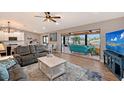Open living space with water views, fireplace, and comfortable seating at 128 Sinclair Se St, Port Charlotte, FL 33952