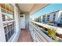 Private balcony overlooking parking lot and other buildings at 1552 Stickney Point Rd # 403, Sarasota, FL 34231