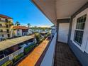 Balcony with water view and partial view of neighboring buildings at 1552 Stickney Point Rd # 403, Sarasota, FL 34231