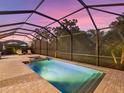 Inviting screened pool and spa with ample deck space at 16203 Tradewind Ter, Lakewood Ranch, FL 34211