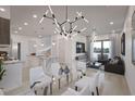 Modern dining room and kitchen with island at 2194 Fruitville Rd, Sarasota, FL 34237