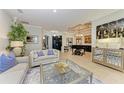 Elegant living room featuring a piano and ample natural light at 22623 Morning Glory Cir, Bradenton, FL 34202