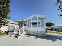 Exterior view of a charming light blue home at 3333 26Th E Ave # 1116, Bradenton, FL 34208