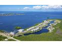 Aerial view of waterfront community with marina and lagoon at 379 Aruba Cir # 301, Bradenton, FL 34209