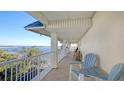 Spacious balcony overlooking the water with comfortable seating at 3810 Gulf Of Mexico Dr # F402, Longboat Key, FL 34228