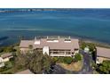 Aerial view of waterfront condo building with parking and waterfront access at 3860 Mariners Way # 413, Cortez, FL 34215