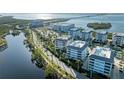 Aerial view showing condo location, nearby waterway, and road at 395 Aruba Cir # 302, Bradenton, FL 34209