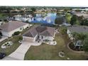 Single-Gathering home with a view of a lake and surrounding community at 4111 Hemingway Dr, Venice, FL 34293
