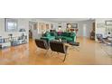 Bright living room with hardwood floors, green sofa, and large windows at 435 S Gulfstream Ave # 604, Sarasota, FL 34236
