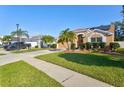 Two-story house with a spacious yard and palm trees at 4440 Sanibel Way, Bradenton, FL 34203