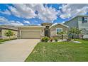 One-story home with a two-car garage and neatly landscaped front yard at 5282 Grove Mill Loop, Bradenton, FL 34211