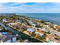 Bird's-eye view highlighting the home's canal-side location at 606 Gladstone Ln, Holmes Beach, FL 34217