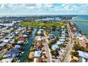 Wide aerial showcasing home's location in a waterfront community at 606 Gladstone Ln, Holmes Beach, FL 34217