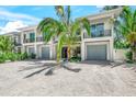 Contemporary two-story home with attached garage and landscaping at 6530 Peacock Rd, Sarasota, FL 34242