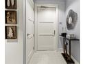 Bright entryway with decorative mirror and console table at 711 S Palm Ave # 303, Sarasota, FL 34236