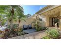 Condo entrance with patio and well-maintained landscaping at 7938 Pinegrove Ct # 12, Sarasota, FL 34238