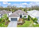 Luxury home with dark gray roof and nicely landscaped yard at 9085 Bernini Pl, Sarasota, FL 34240