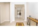 Bright and spacious entryway with tile floors and console table at 9814 Daybreak Gln, Parrish, FL 34219