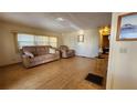 Living room featuring light wood floors and comfortable seating at 10315 Cortez W Rd # 37F, Bradenton, FL 34210