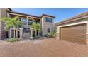 Two-story condo with attached garage and paved parking at 12413 Osorio Ct # 103, Sarasota, FL 34238