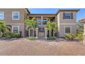 Two-story condo building with balconies and parking area at 12413 Osorio Ct # 103, Sarasota, FL 34238