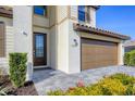 Front entrance and garage with landscaping at 15859 Islandwalk Ave, Bradenton, FL 34211