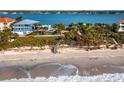 Elevated view of waterfront home with beach access and stunning ocean views at 1620 Casey Key Rd, Nokomis, FL 34275