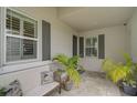 Covered entry with tiled flooring, seating area and potted plants at 192 Van Gogh Cv, Bradenton, FL 34212