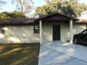Front view of a single story home with a covered entry at 219 E Early St, Brooksville, FL 34601